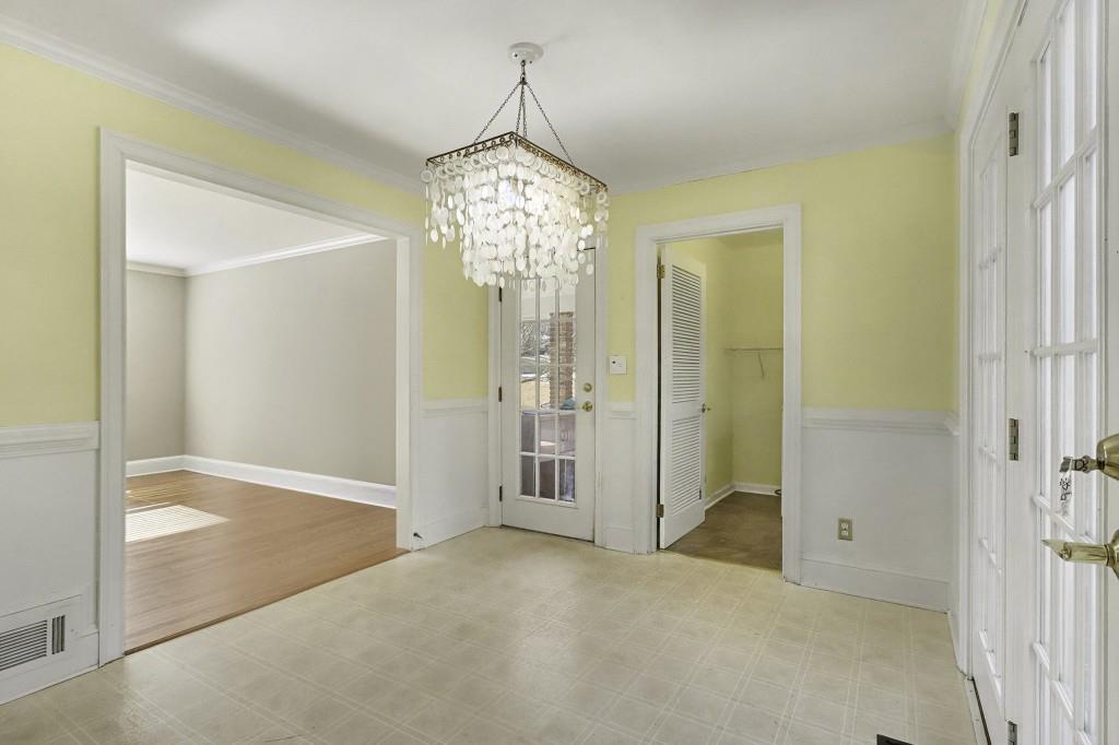 2524 Asbury Court Decatur, GA 30033 - Photo 10 of 26 an empty room and chandelier glass door