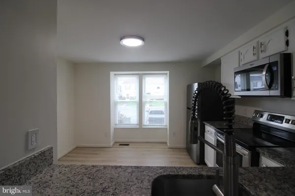 a view of workspace with furniture and window