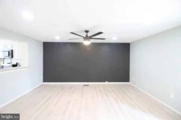 a view of a kitchen with a sink and cabinet