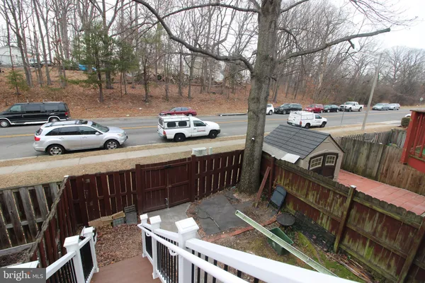 a view of street with parked cars