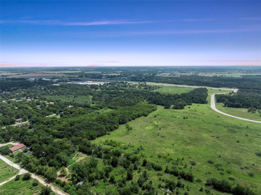 Tbd Phillip Street Marlin, TX 76661 - Photo 11 of 18 a view of a lush green outdoor space with a lake view