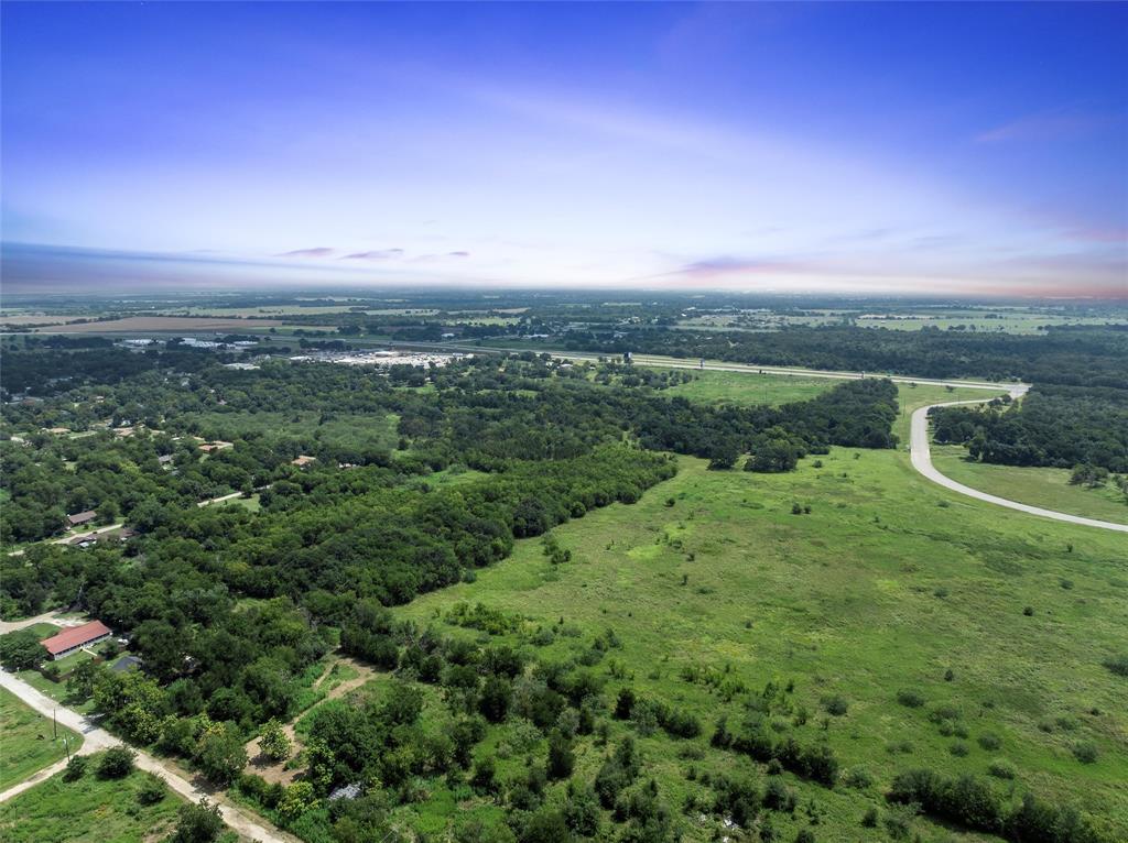 Tbd Phillip Street Marlin, TX 76661 - Photo 15 of 18 a view of a city with lush green forest