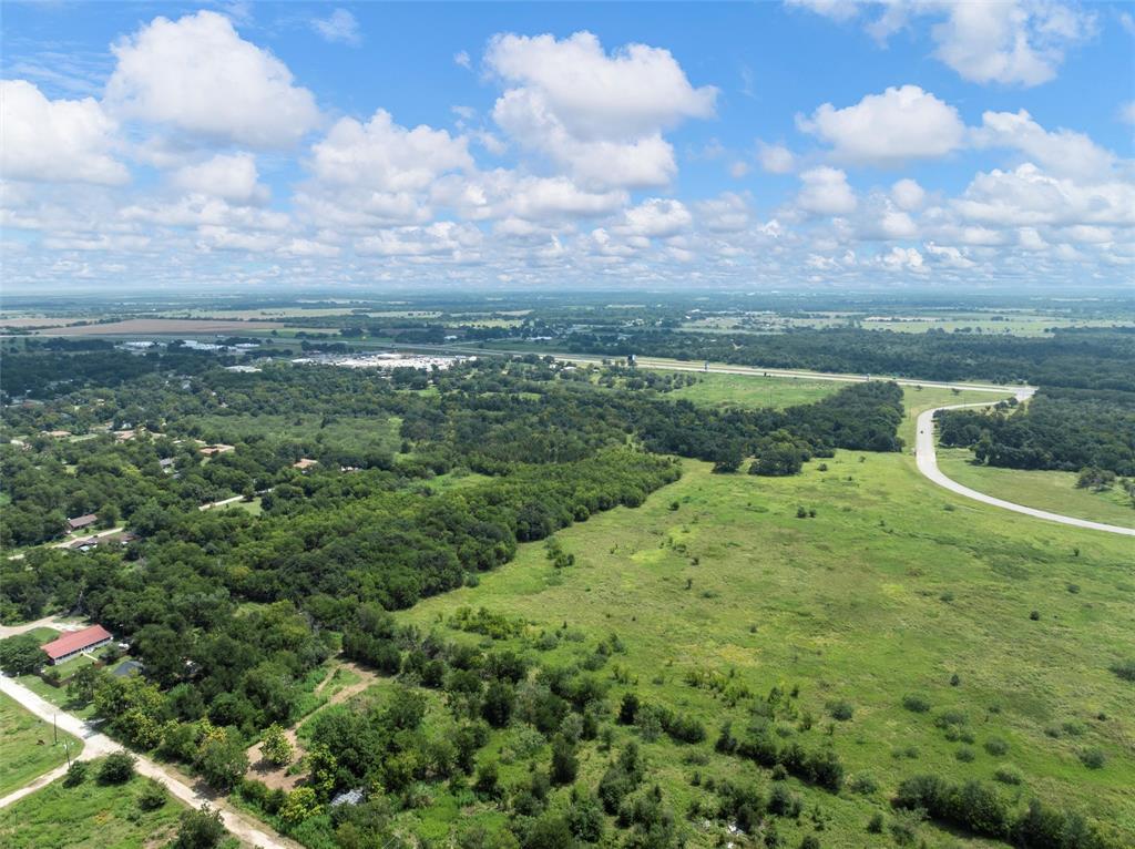 Tbd Phillip Street Marlin, TX 76661 - Photo 16 of 18 a view of a city with lush green forest