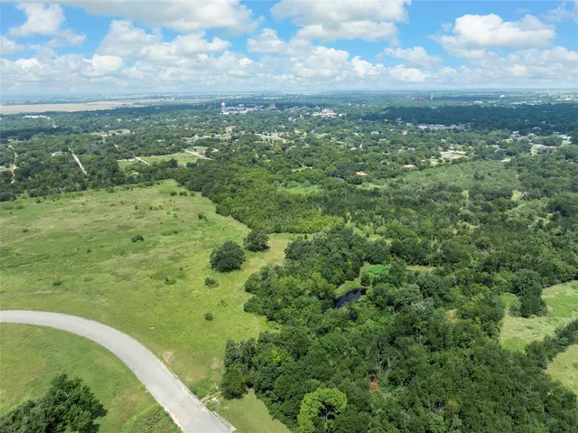 a view of a field with an ocean
