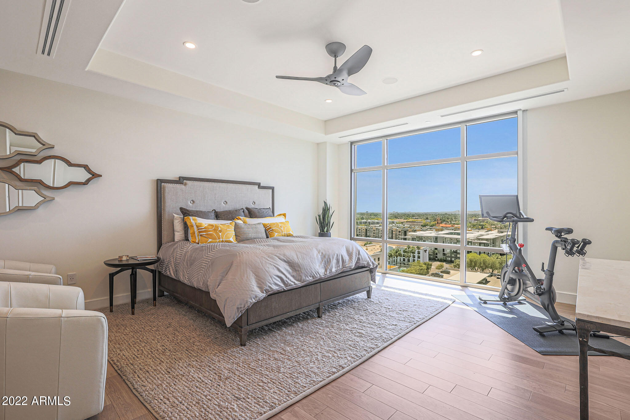 2211 East Camelback Road, Unit 1105/06 Phoenix, AZ 85016 - Photo 54 of 69 a bedroom with a bed mirror and a large window