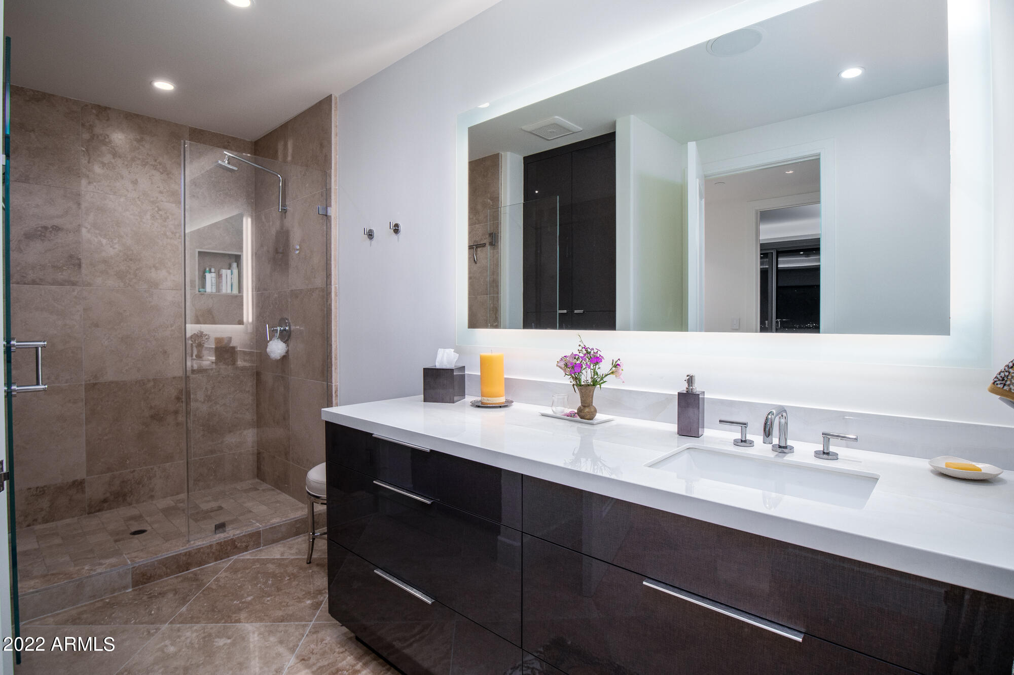 2211 East Camelback Road, Unit 1105/06 Phoenix, AZ 85016 - Photo 55 of 69 a bathroom with a shower sink double and mirror