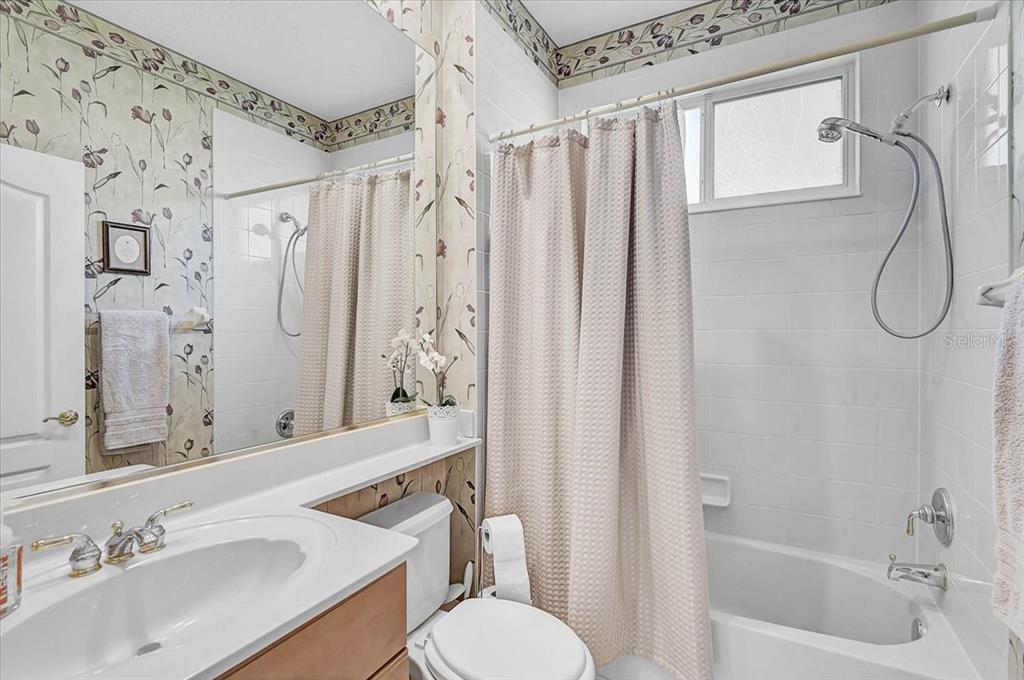 103 Bishopscourt Road Osprey, FL 34229 - Photo 21 of 55 a bathroom with a sink toilet and shower