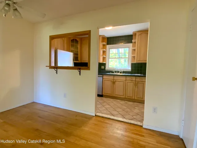 a view of a kitchen cabinets and a wooden floor
