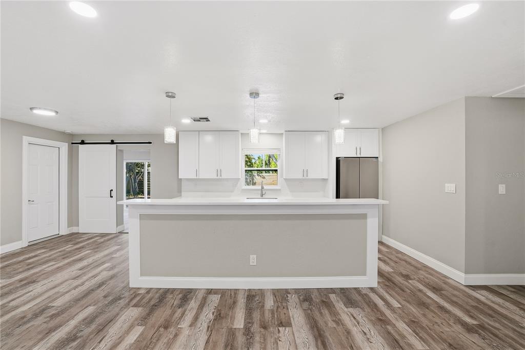 11525 81st Place Seminole, FL 33772 - Photo 14 of 24 a view of kitchen with stainless steel appliances a refrigerator sink and cabinets