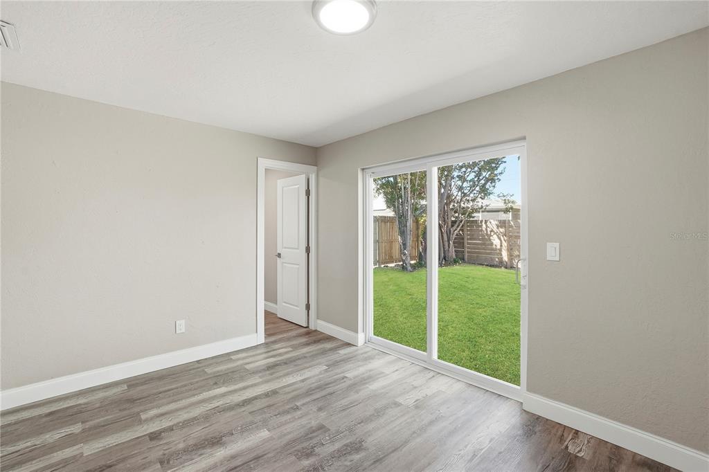 11525 81st Place Seminole, FL 33772 - Photo 18 of 24 a view of a room with a large window and wooden floor