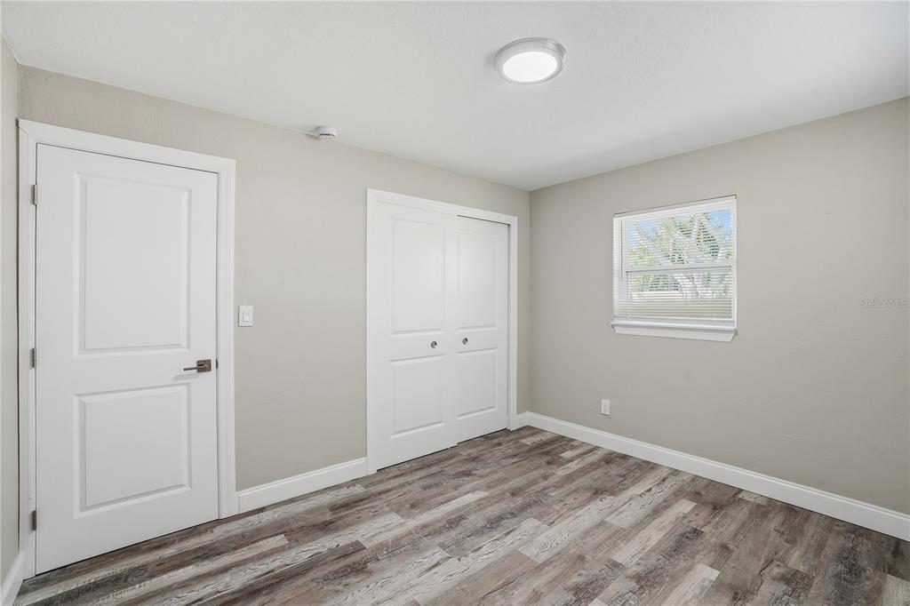 11525 81st Place Seminole, FL 33772 - Photo 7 of 24 a view of room with window and wooden floor
