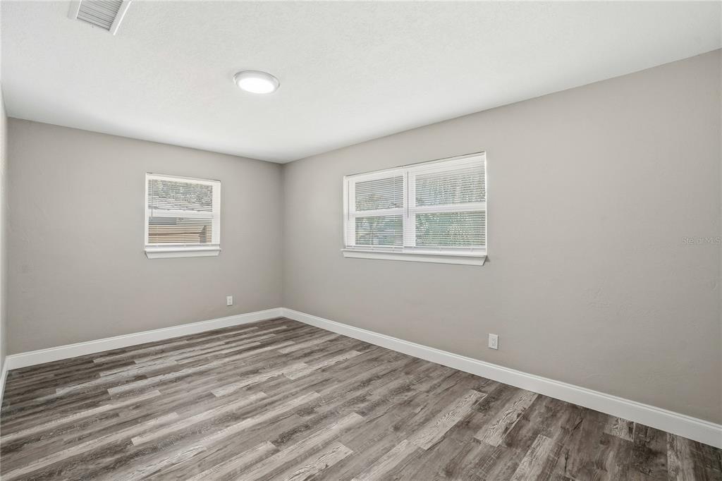 11525 81st Place Seminole, FL 33772 - Photo 9 of 24 a view of a room with wooden floor and windows