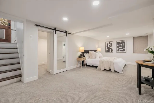 a bed room with a bed and a couch