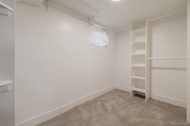 a view of an empty walk in closet