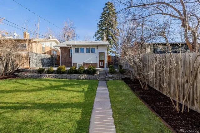 a front view of a house with yard