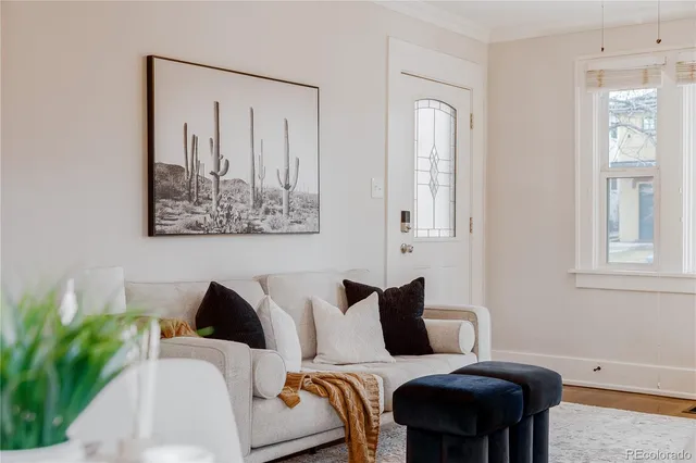 a living room with furniture and a window