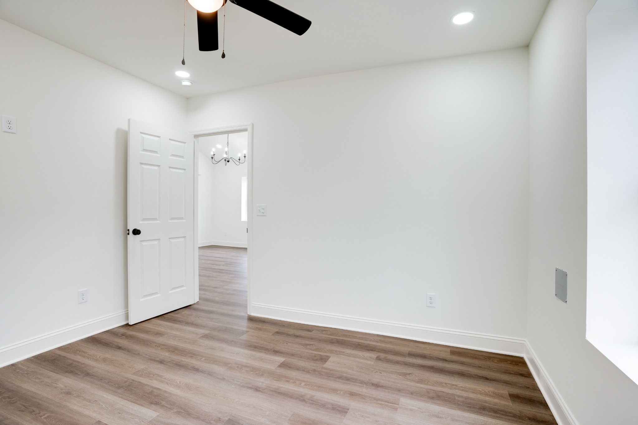 514 Smith Street Springfield, TN 37172 - Photo 17 of 25 an empty room with wooden floor ceiling fan and window