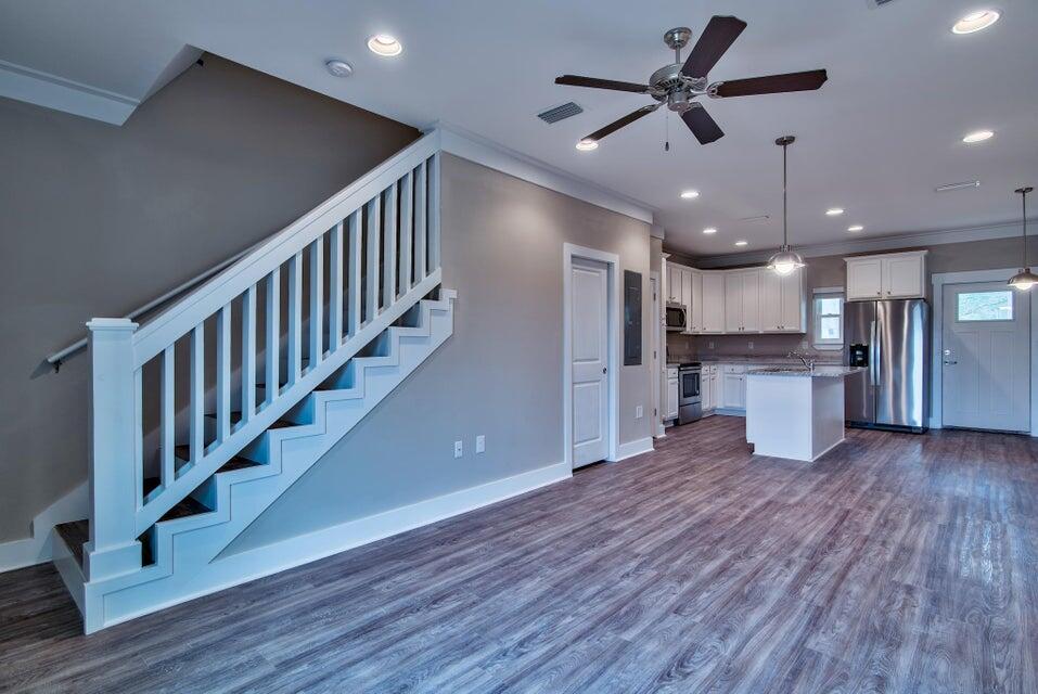 45 North Sand Palm Road Freeport, FL 32439 - Photo 17 of 32 a view of kitchen with refrigerator stove and wooden floor