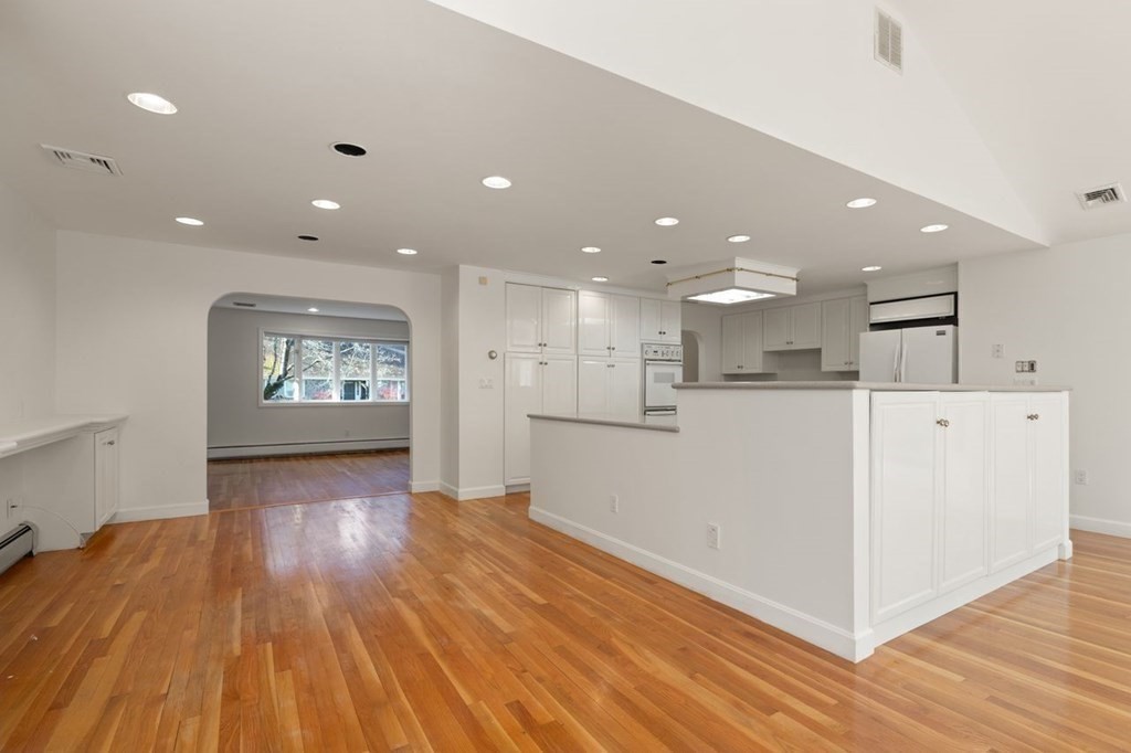 17 Dudley Road Lexington, MA 02421 - Photo 8 of 29 a view of a kitchen with wooden floor and windows