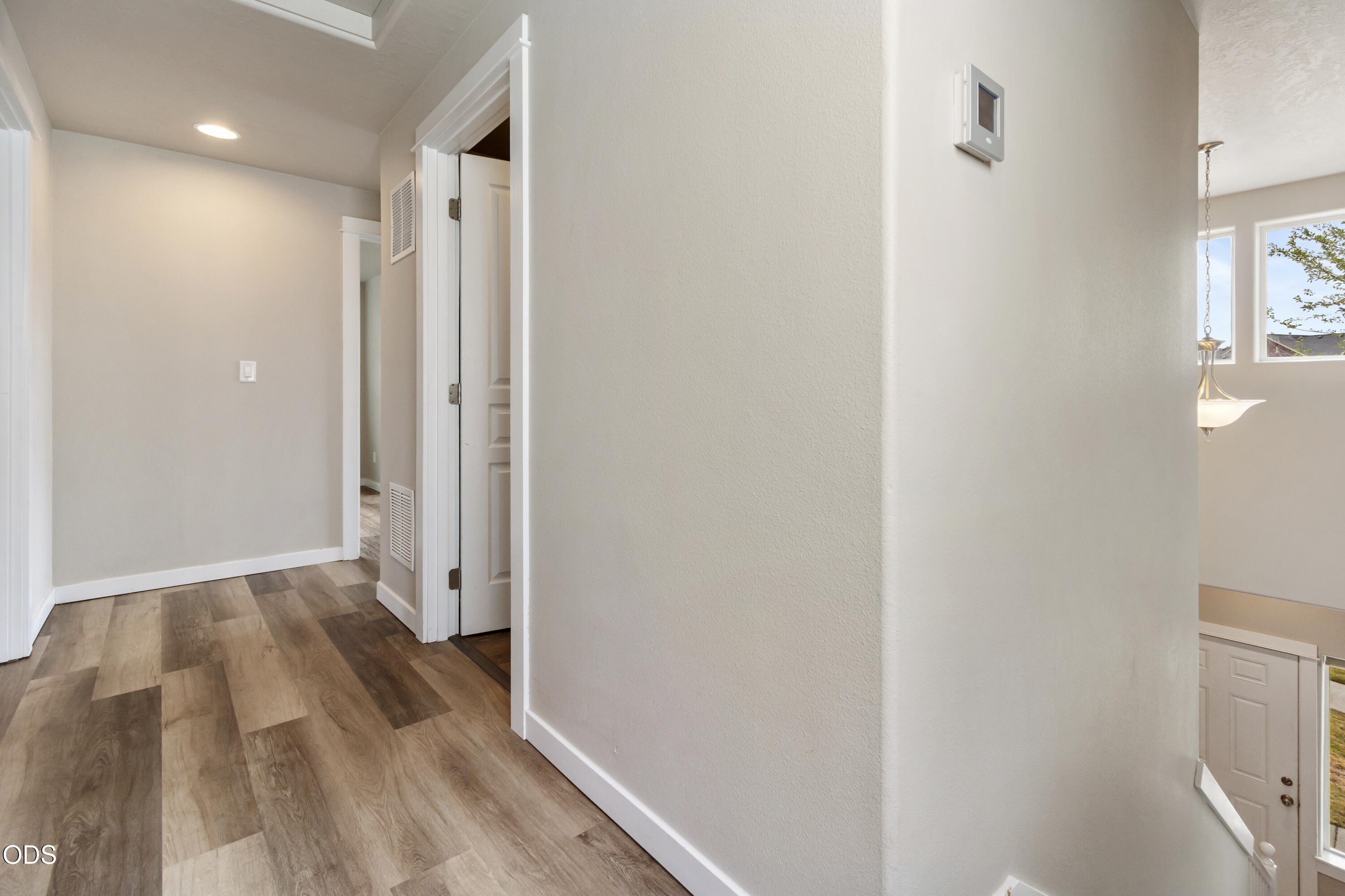 21332 Oconnor Way Bend, OR 97701 - Photo 10 of 33 a view of hallway with wooden floor