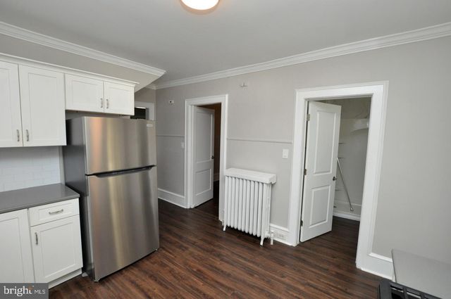 a refrigerator freezer sitting inside of a kitchen