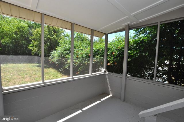 a view of a room with a large window