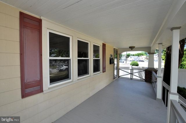 a view of living room filled with furniture and window