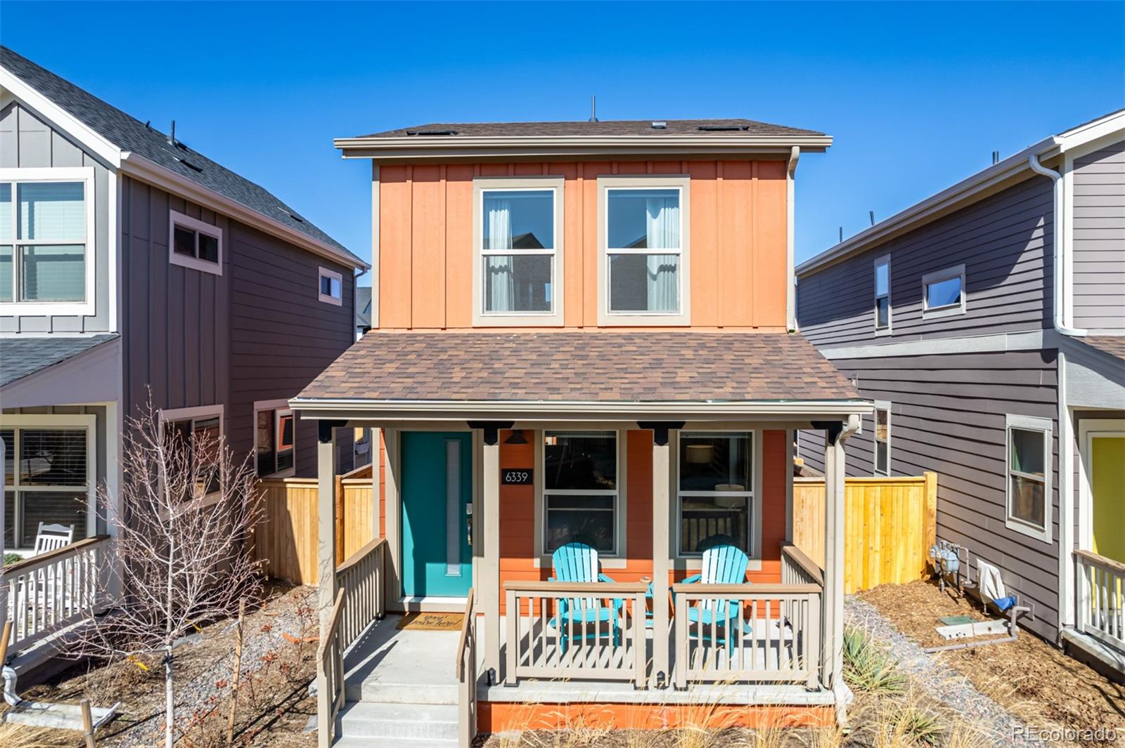6339 North Hanover Street Denver, CO 80238 - Photo 1 of 24 a front view of a house with a garden
