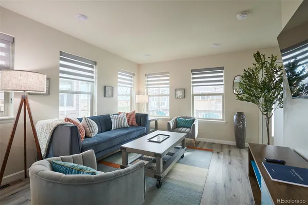 a living room with furniture and a large window