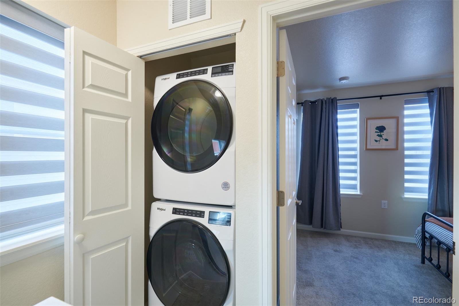 6339 North Hanover Street Denver, CO 80238 - Photo 17 of 24 a view of a hallway with washer and dryer