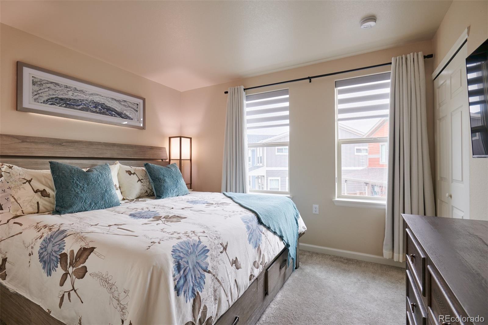6339 North Hanover Street Denver, CO 80238 - Photo 21 of 24 a bedroom with a bed and a large window