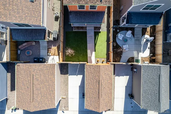 an aerial view of a house with a ocean view