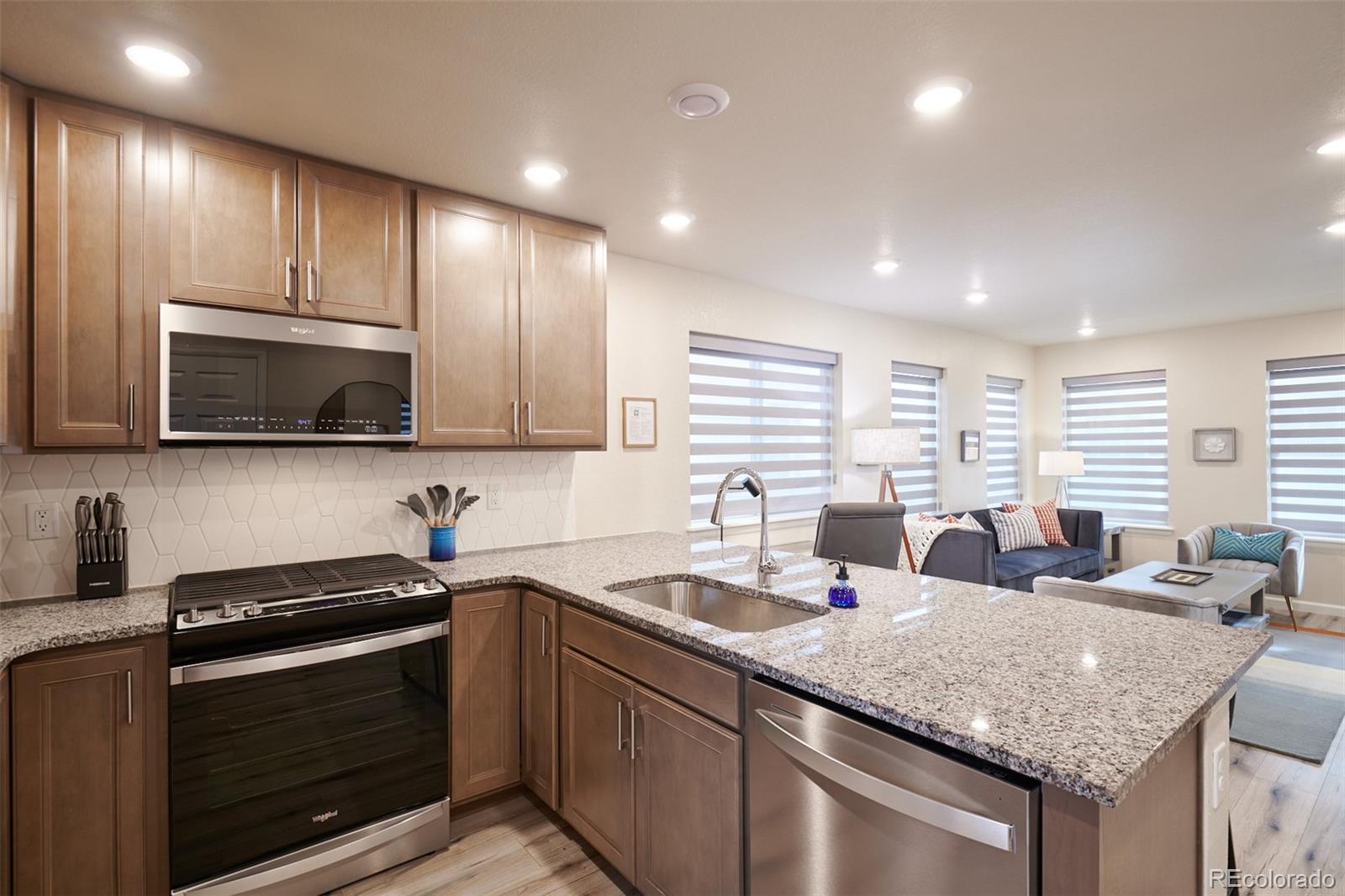 6339 North Hanover Street Denver, CO 80238 - Photo 7 of 24 a kitchen with lots of counter space and a sink