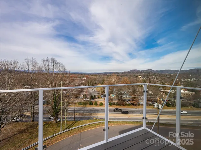 a view of a balcony with city view