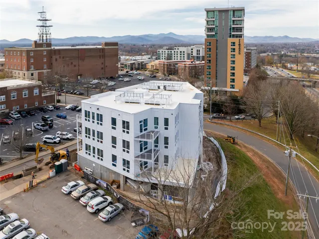 a view of a building with a yard