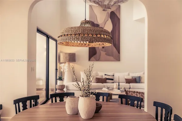 a living room with lots of furniture and a chandelier