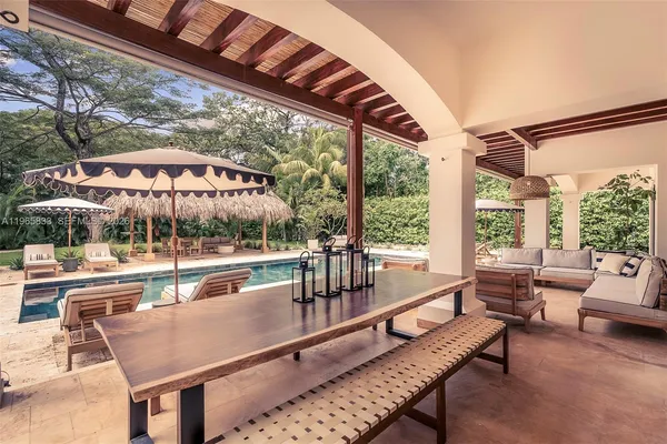 a view of swimming pool with outdoor seating