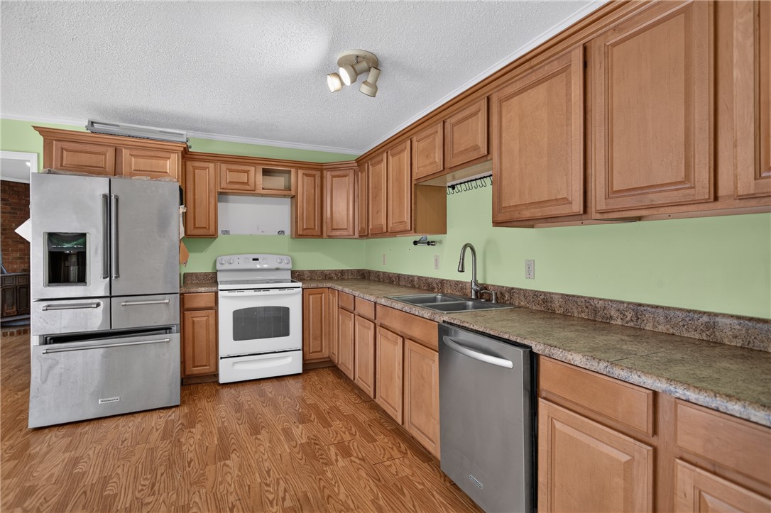 123 Robin Road Westminster, SC 29693 - Photo 16 of 50 A well-appointed kitchen features ample cabinetry, durable countertops, and sleek stainless steel appliances.