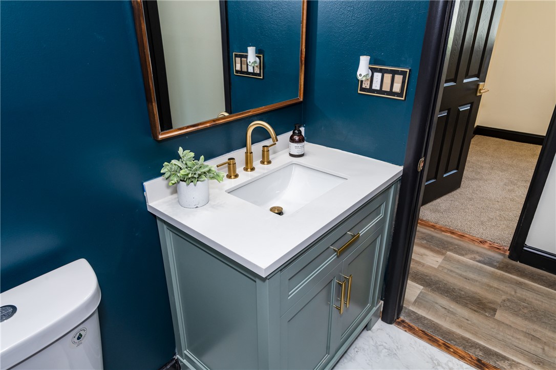5240 Haverfield Road Dayton, OH 45432 - Photo 41 of 58 This bathroom features a contemporary vanity with a sleek countertop and stylish fixtures.