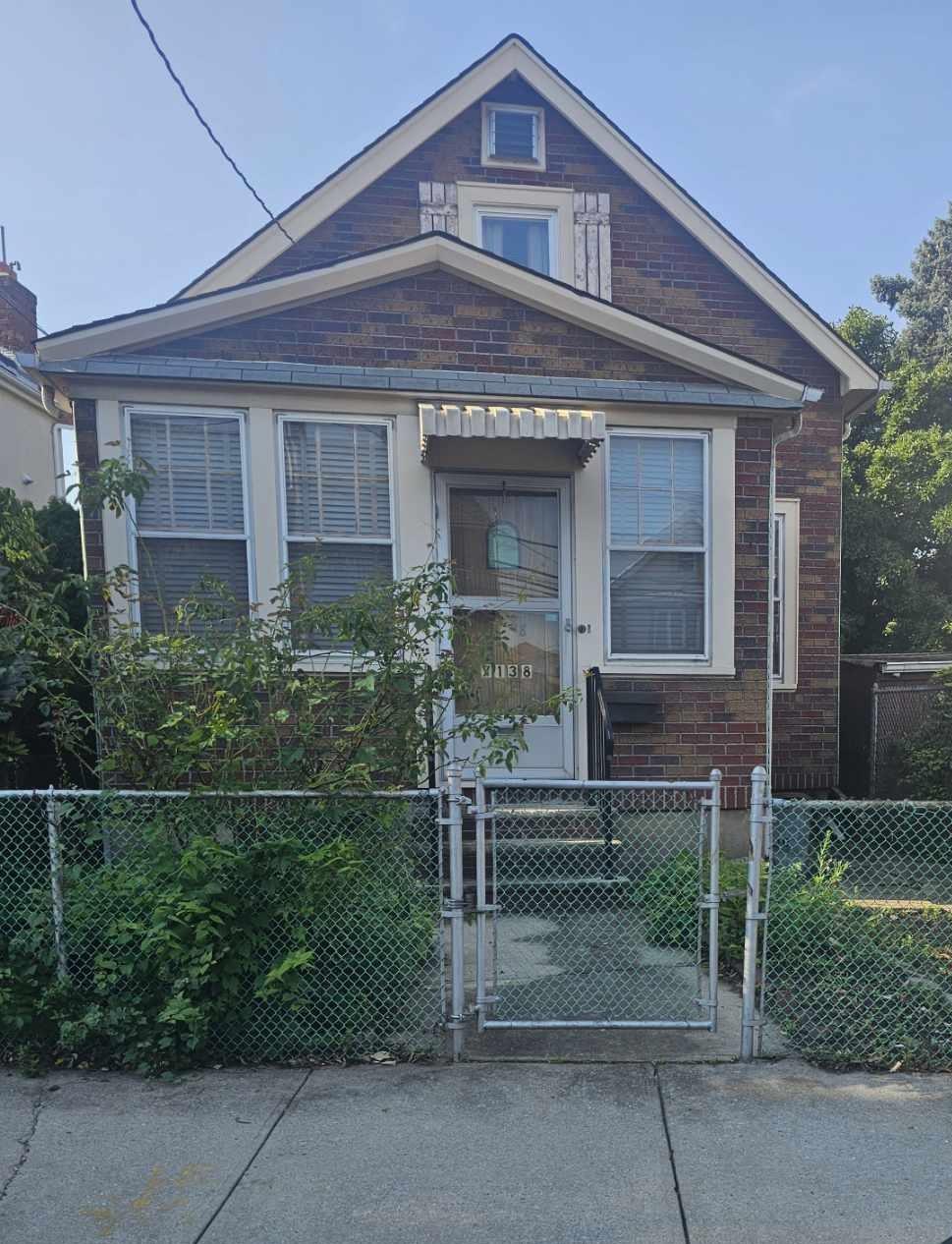front view of a house with a garden