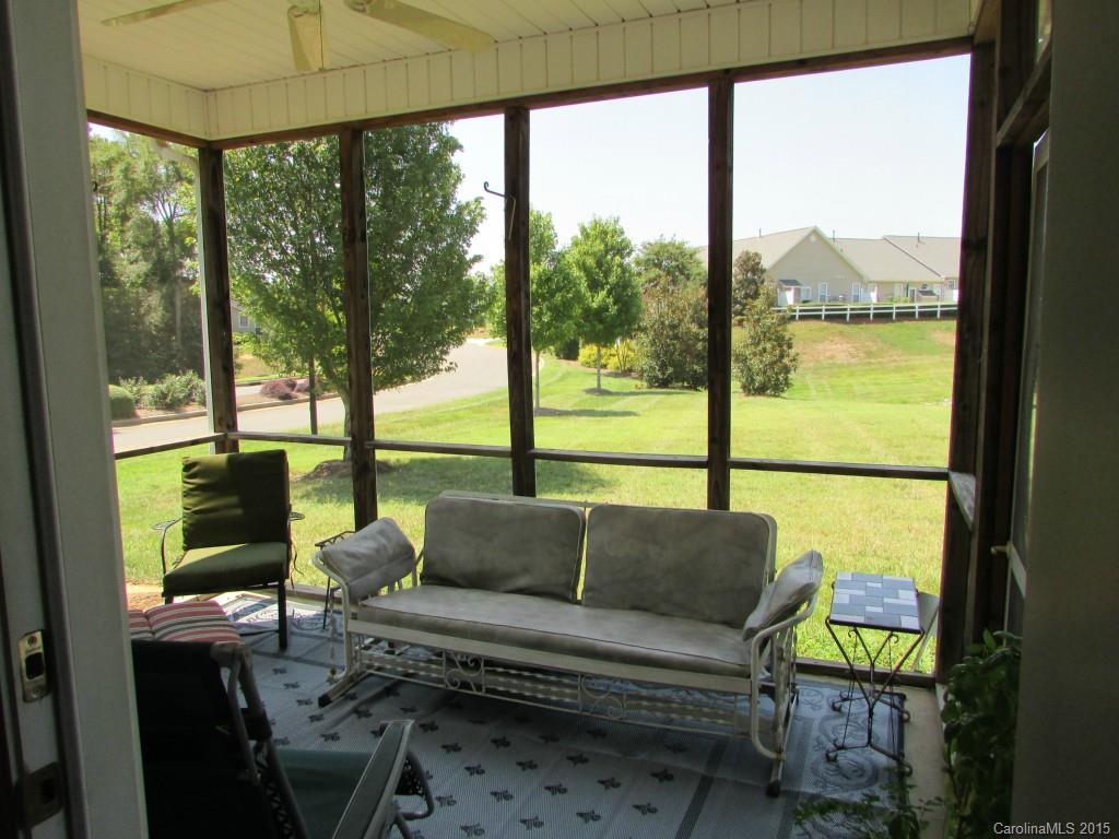 769 Platinum Drive Fort Mill, SC 29708 - Photo 14 of 19 a living room with large windows and a table