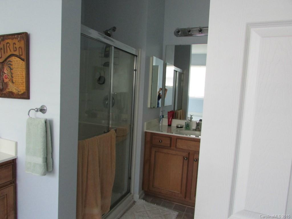 769 Platinum Drive Fort Mill, SC 29708 - Photo 19 of 19 a bathroom with a mirror sink and shower