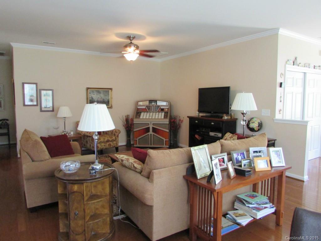 769 Platinum Drive Fort Mill, SC 29708 - Photo 9 of 19 a living room with furniture a lamp and a flat screen tv