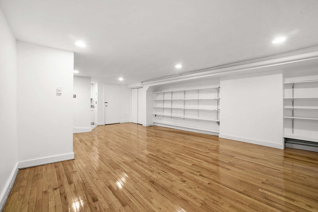 6 Dwight Street, Unit 1 Boston, MA 02118 - Photo 12 of 20 a view of empty room with wooden floor and window