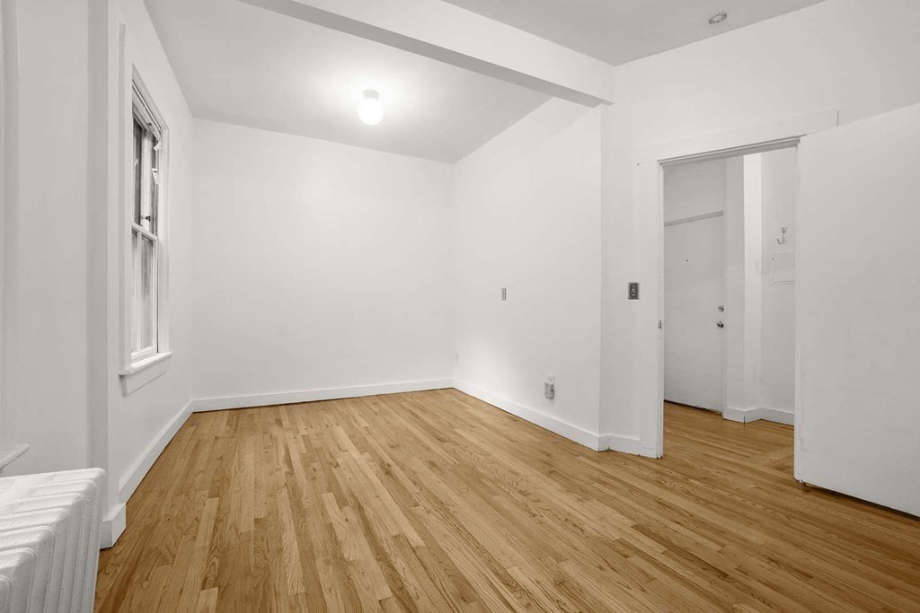 6 Dwight Street, Unit 1 Boston, MA 02118 - Photo 5 of 20 a view of room with wooden floor