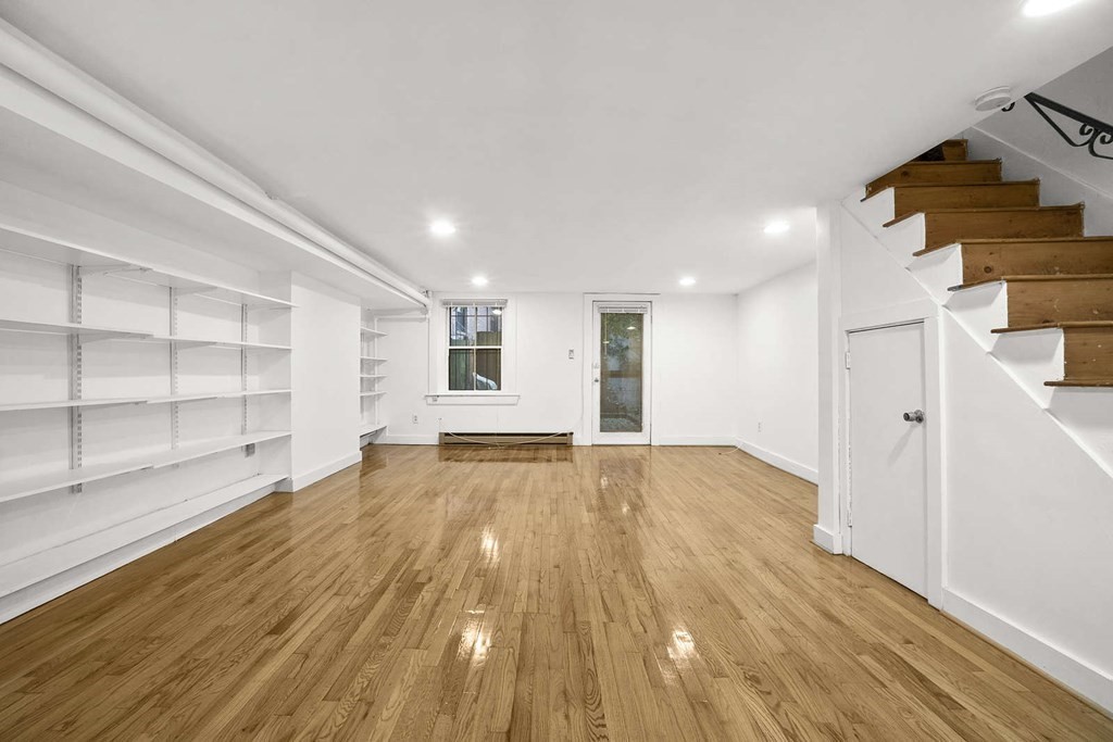 6 Dwight Street, Unit 1 Boston, MA 02118 - Photo 10 of 20 a view of empty room with wooden floor and cabinet