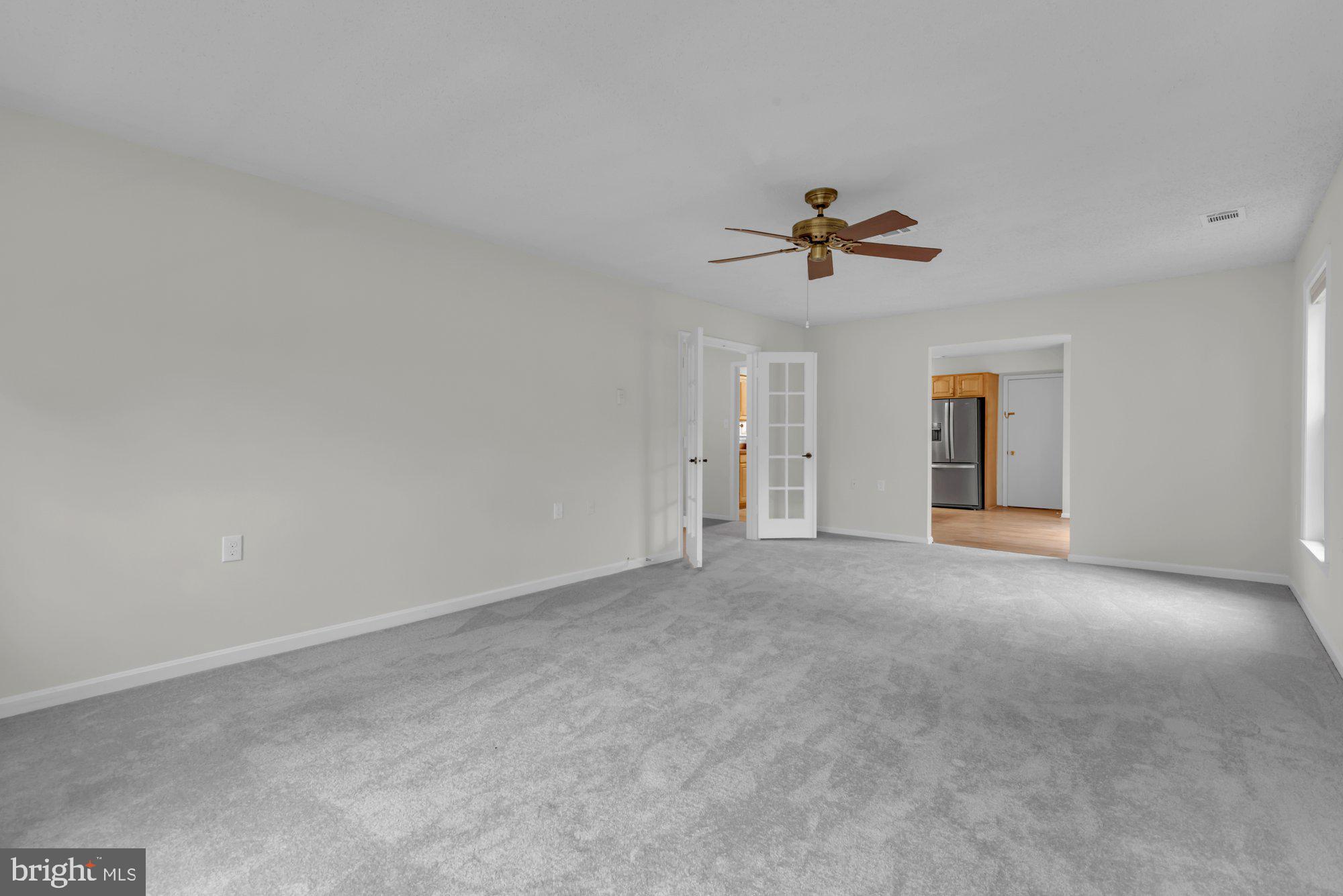 2572 Golfers Ridge Road Annapolis, MD 21401 - Photo 13 of 69 a view of a room with a ceiling fan and wooden floor