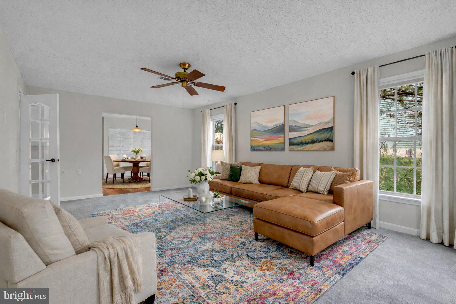 2572 Golfers Ridge Road Annapolis, MD 21401 - Photo 14 of 69 a living room with furniture a ceiling fan and a window