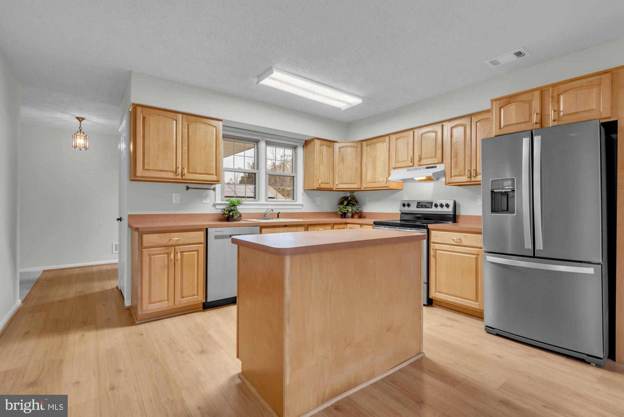 2572 Golfers Ridge Road Annapolis, MD 21401 - Photo 19 of 69 a kitchen with a refrigerator stove top oven and sink