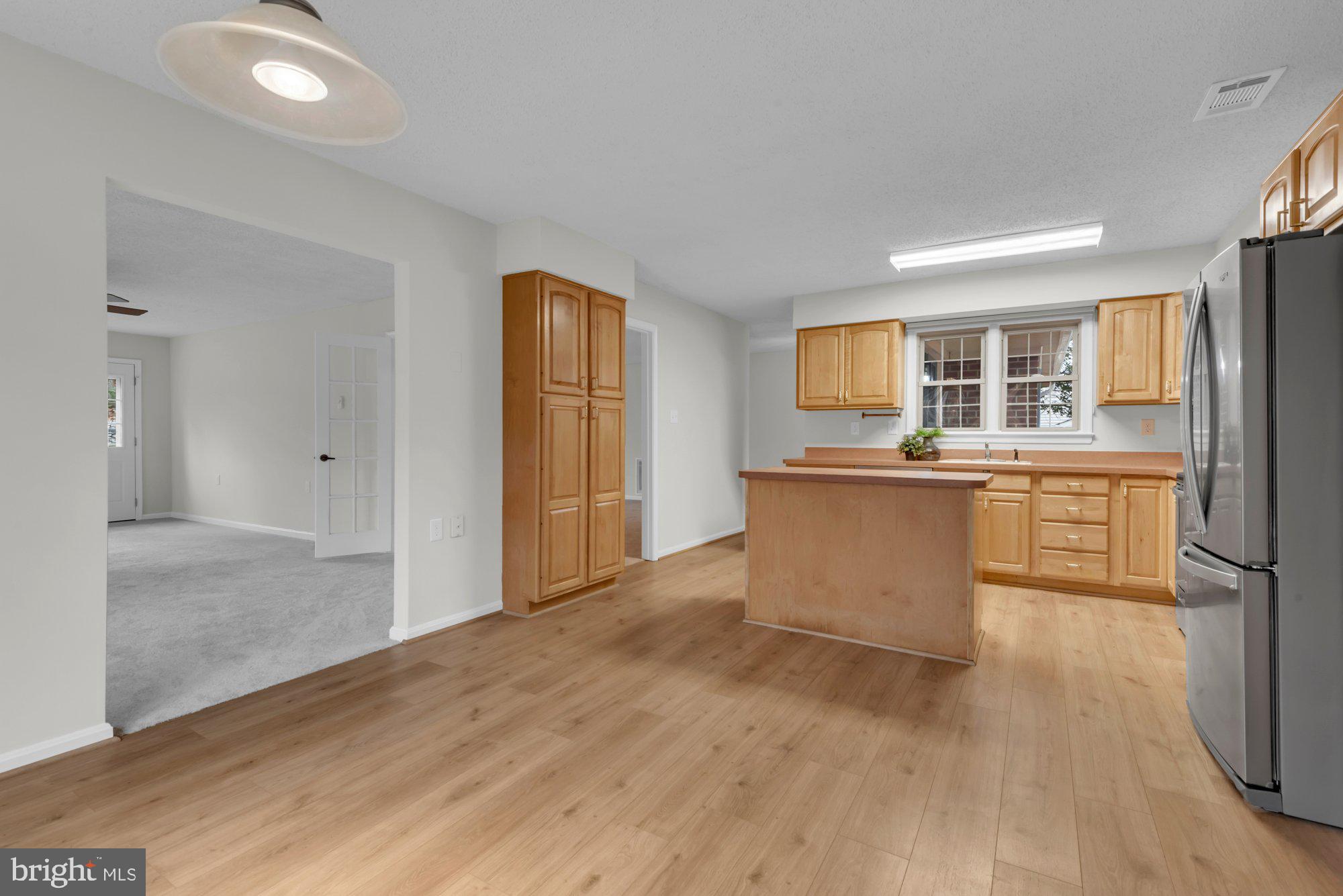2572 Golfers Ridge Road Annapolis, MD 21401 - Photo 24 of 69 a view of kitchen with granite countertop cabinets and refrigerator
